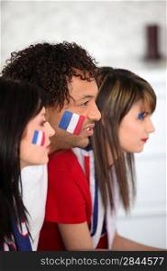 A group of French supporters watching a football game