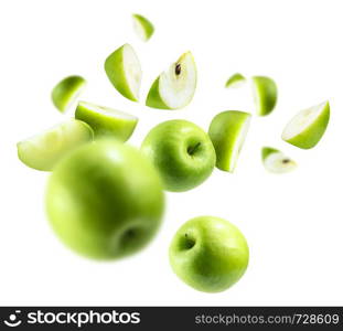 A group of green apples levitating on a white background.. A group of green apples levitating on a white background