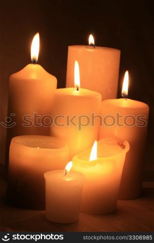 A group of ivory white candles in different sizes