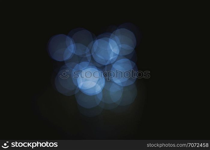 A group of lights defocused in the darkness, Lens effect light bokeh abstract background