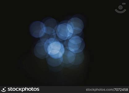 A group of lights defocused in the darkness, Lens effect light bokeh abstract background