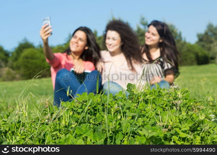 A group of students relaxing at the park - Selective focus on the grass