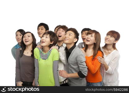 A group of young people looking up in excitement