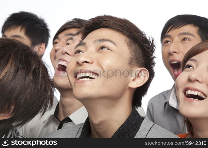 A group of young people looking up in excitement