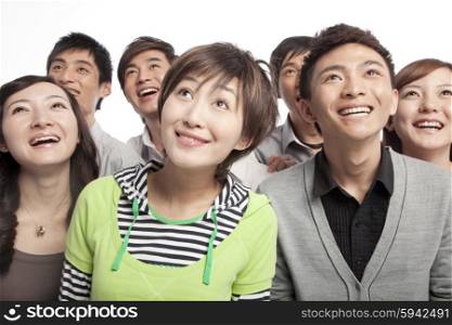 A group of young people looking up in excitement