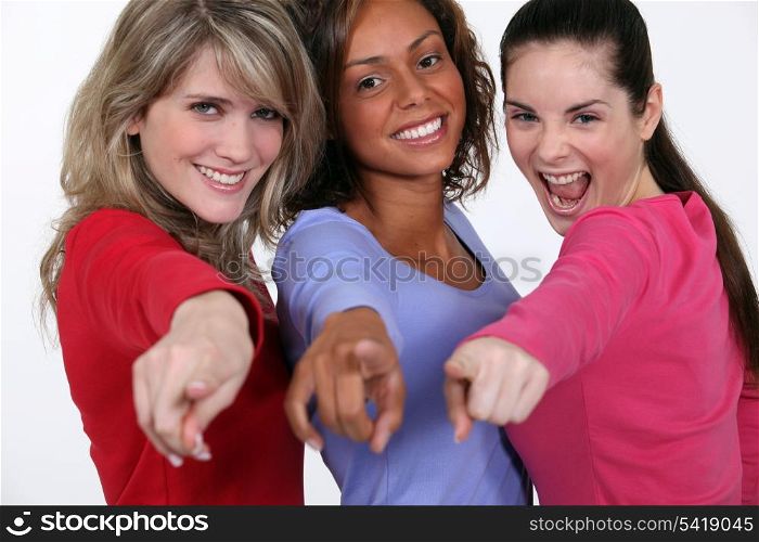 A group of young women pointing their fingers
