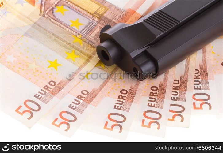 A gun on top of some 50 euro banknotes