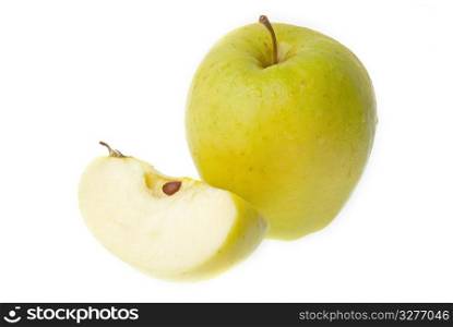 A half and a whole fresh green apple isolated on white background.
