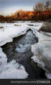 A half frozen river in November. Shot in early morning. Kin Coulee, Medicine Hat, Alberta, Canada.