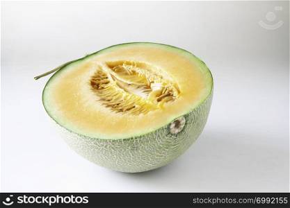 A half of orange Melon isolated on white background with clipping path