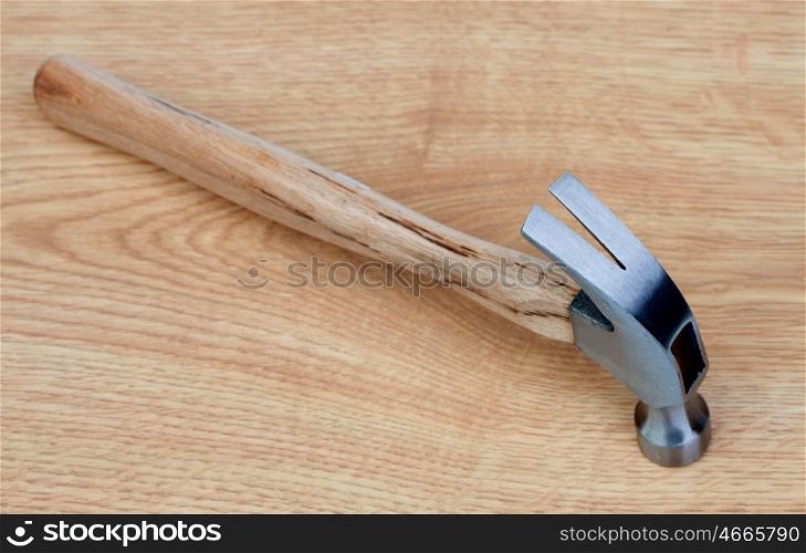 A hammer metal on a wooden background
