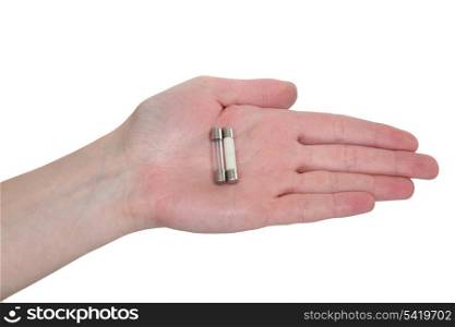 A hand holding fuses.