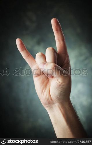 A Hand making a Sign of the horns aka devil sign aka maloik