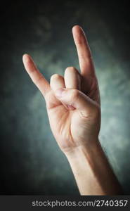 A Hand making a Sign of the horns aka devil sign aka maloik