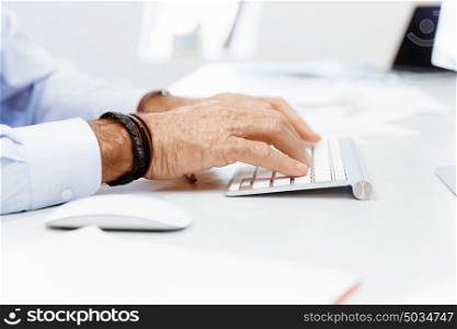 A hand of businessman with a computer mouse. Being connected and in touch