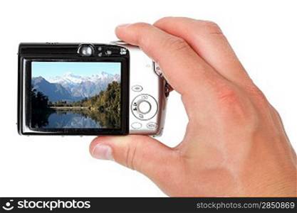 A hand taking digital pictures