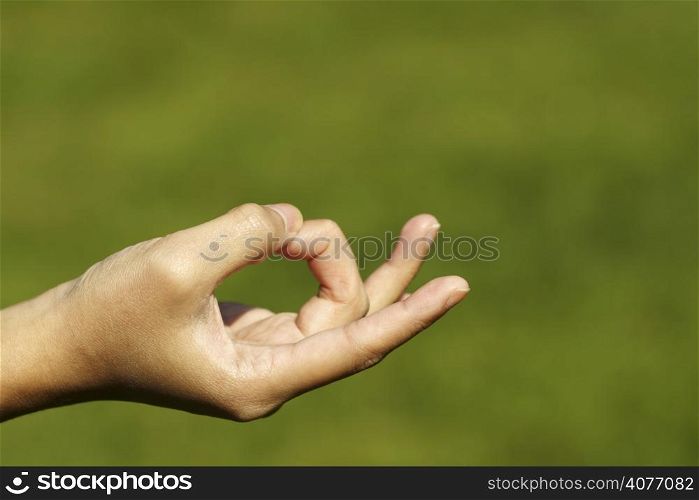 A hand with fingers ini meditation/yoga position
