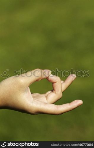 A hand with fingers ini meditation/yoga position