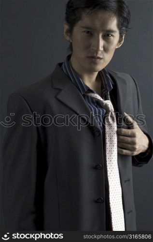 A handsome asian model in smart casual clothing
