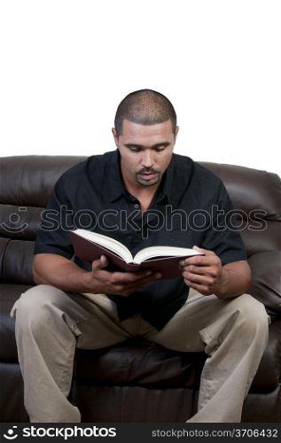 A handsome black man reading a book