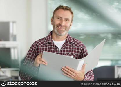 a handsome man with folder
