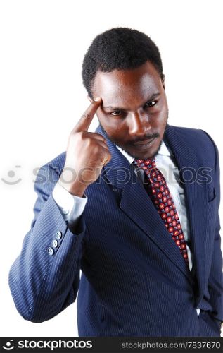 A handsome young black man in a blue suit with one finger on hisforehead, isolated for white background.