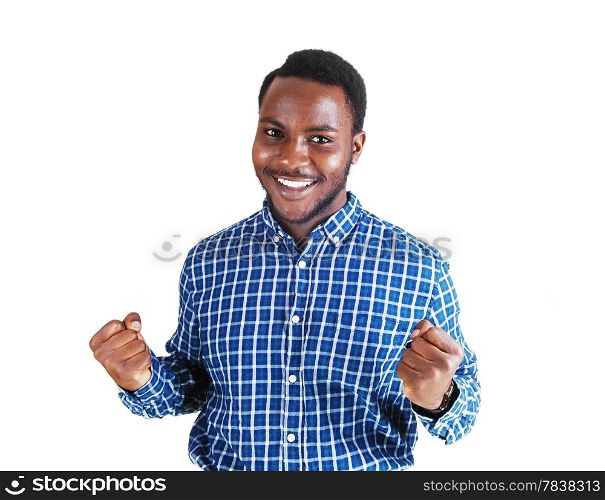 A handsome young black man in a colorful shirt and stretched out armsmaking fist&rsquo;s and smiling, isolated for white background.