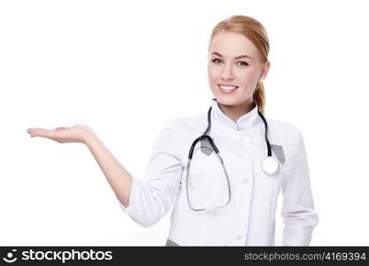 A handsome young doctor shows on a white background