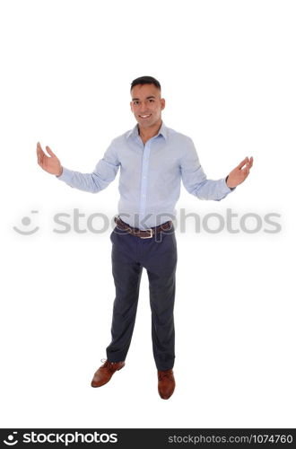 A handsome young east Indian man standing in a blue shirt with his arms wide open, welcome everybody, isolated for white background
