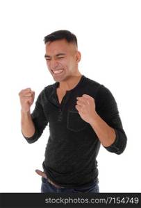 A handsome young man is happy he got what he wants by making fist?s with booths hands and eyes closed, isolated for white background