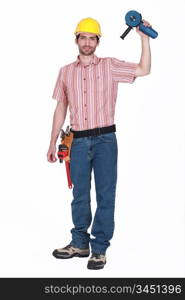 A handyman holding a grinding machine.