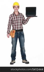 A handyman with a laptop.