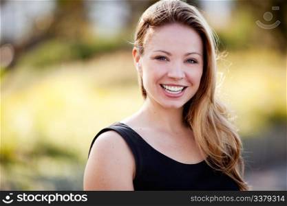 A happy business woman isolated against a difuse background