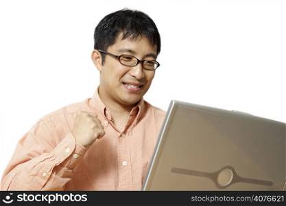 A happy businessman working on his laptop