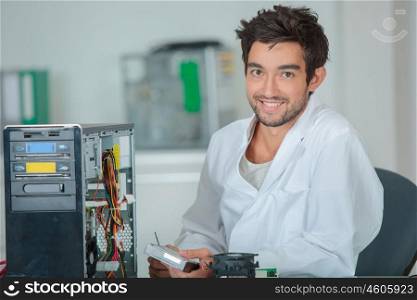 a happy computer hardware technician