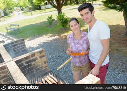a happy couple at a barbeque