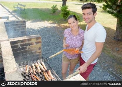 a happy couple at a bbq