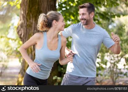 a happy couple is running