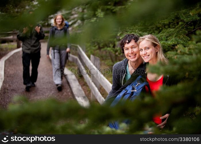 A happy couple on a forest trail