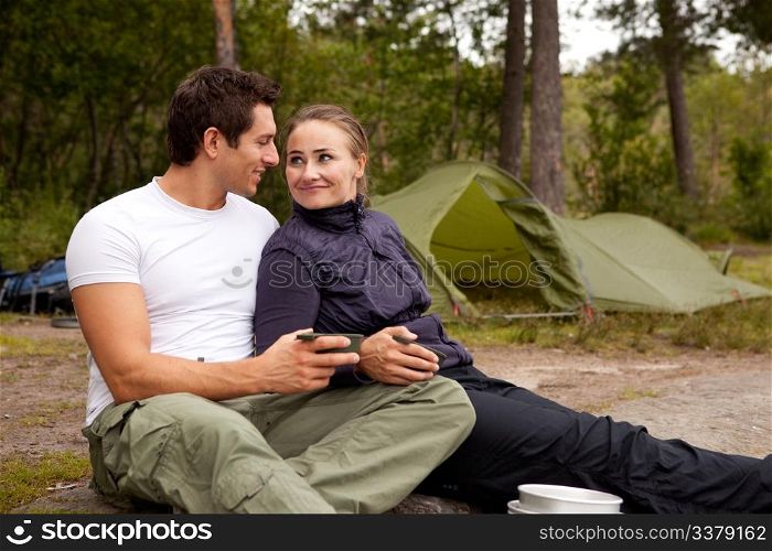 A happy couple outdoors on a camping trip
