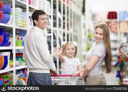A happy family is shopping in a store