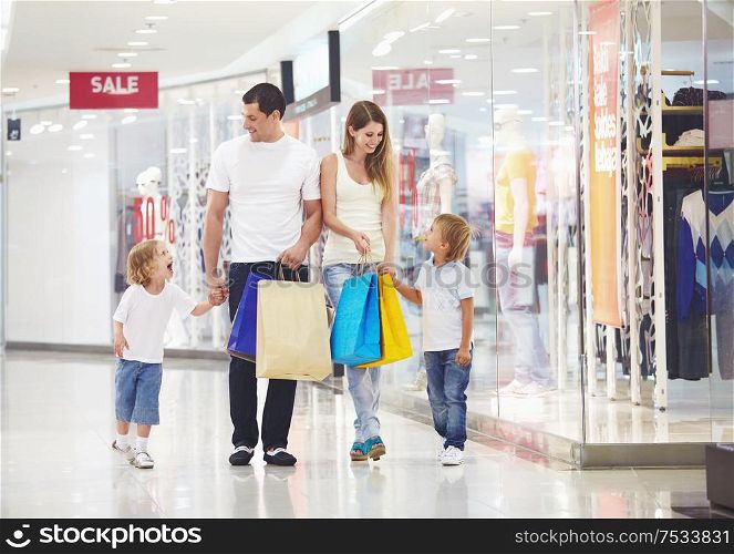 A happy family makes purchases in the store