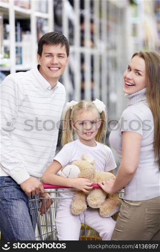 A happy family with a child in a store
