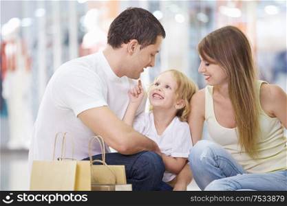 A happy family with a child in the store