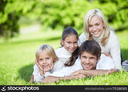 A happy family with two children outdoors