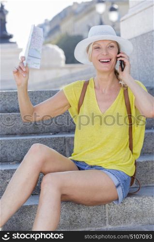 a happy female using smartphone