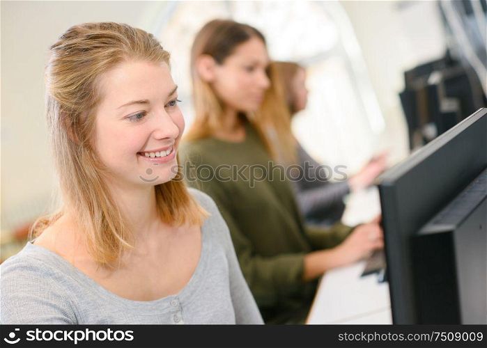 a happy girl using laptop