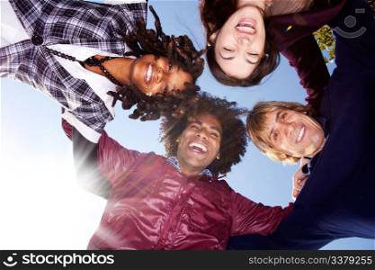 A happy group hug of friends - with solar flare from bottom left