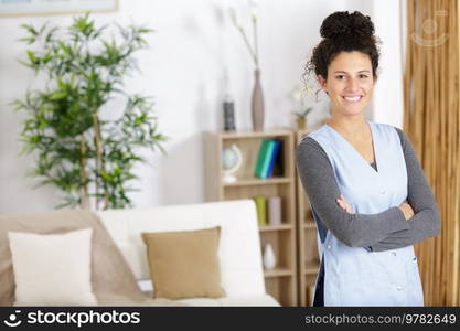 a happy housekeeper smiling at camera