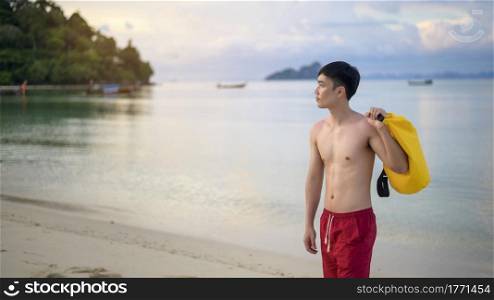 A happy man enjoying and relaxing on the beach, Summer and holidays concept. happy man enjoying and relaxing on the beach, Summer and holidays concept